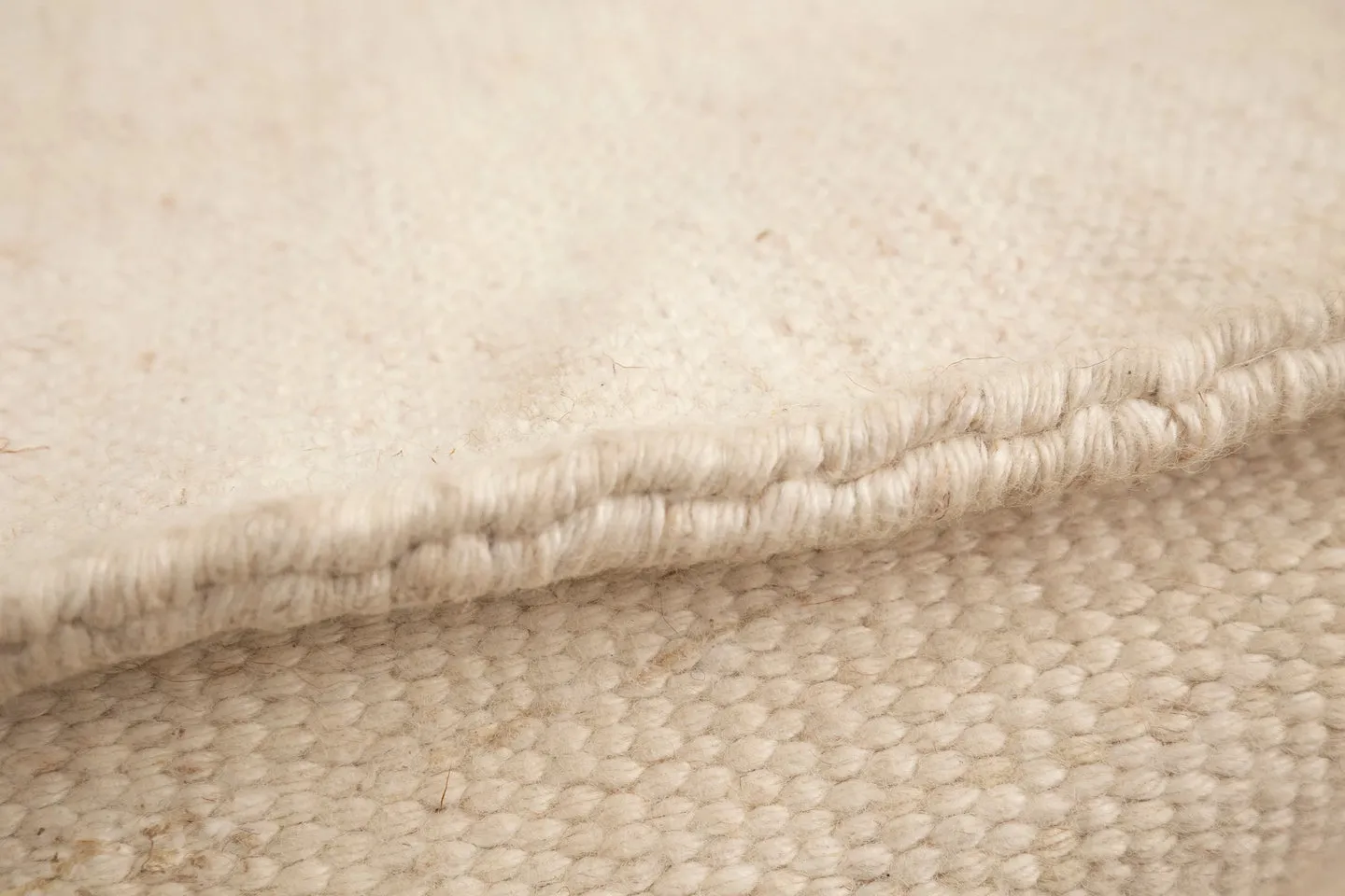 The Boite Wool/Bamboo Bean Bag Ottoman in Beige